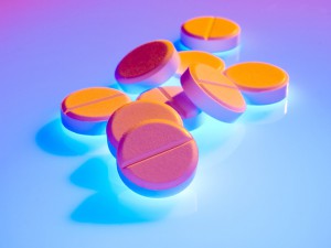 Pills on abstract colored background.